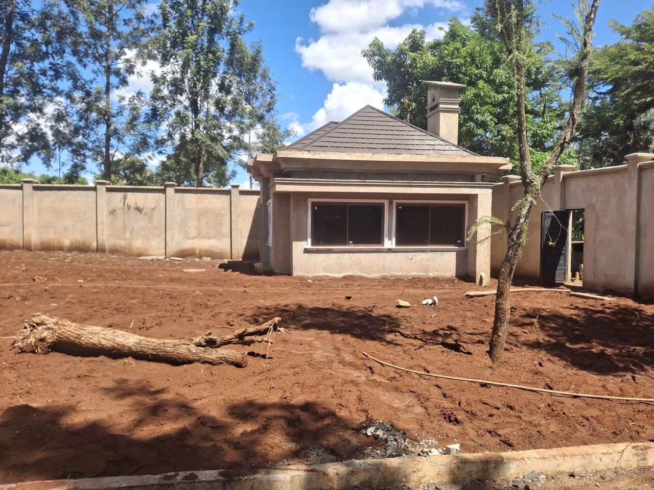 Gatehouse under construction beside the perimeter wall