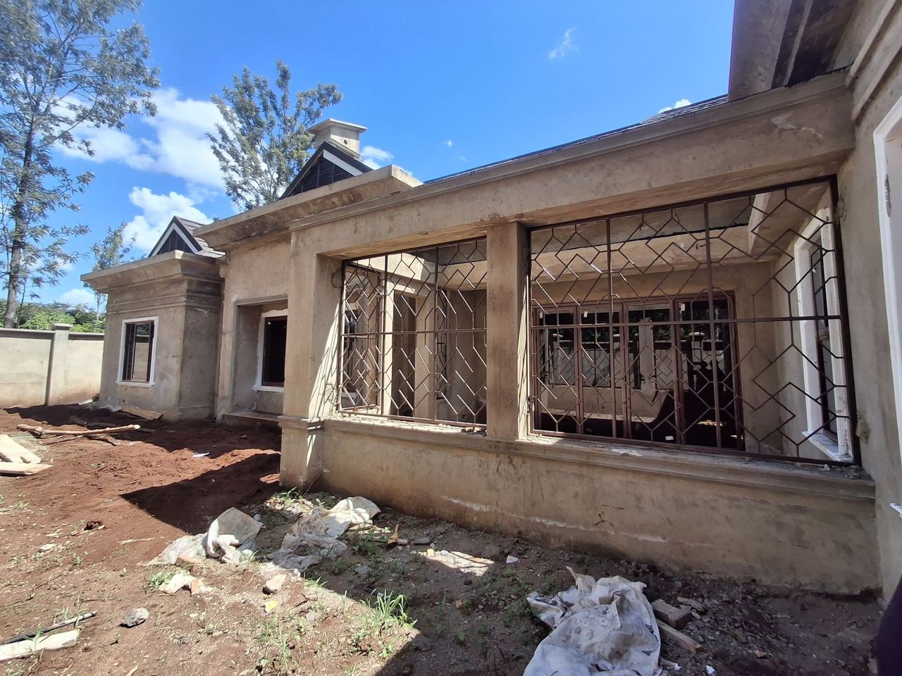 Front veranda with steel window grilles